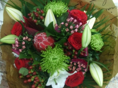 Luxury Romance - A luxury bouquet of Roses, lilies, blooms with a touch of the exotic, perfect for a loved one! Medium price shown.