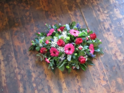 Funeral Tribute - A seasonal open spray in a choice of your colours, a perfect tribute to a loved one.